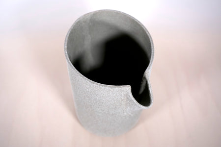 top view of a jug in dark grey clay. 