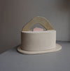 a pale clay butter dish with an abstract handle in two parts by Brutes Ceramics.